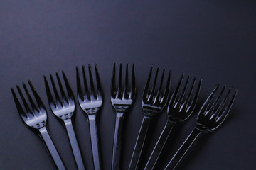 Black forks on dark background
