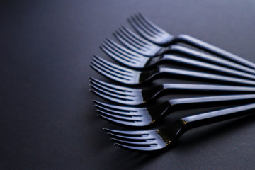 Black forks on dark background