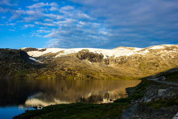 Fototapeta premium Beautiful view of the mountains and the lake from the road. Morning in Norway