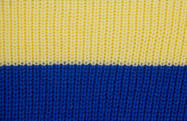 Knit close-up. Colored knitted wool close-up. Yellow-blue flag of Ukraine