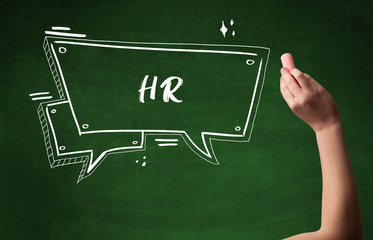 Hand drawing HR abbreviation with white chalk on blackboard