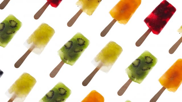 Abstract colorful animation - colorful fruit popsicles moving. Fruit ice lollies color background, 4k.
