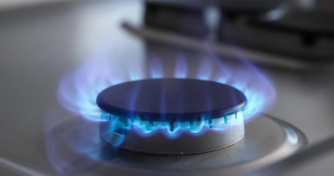4k ProRes slow motion clip of a propane gas burner on a stove-top appliance igniting