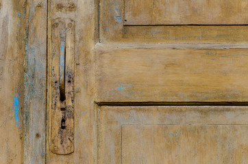 vintage. old wooden door and rusty iron knocker. close-up