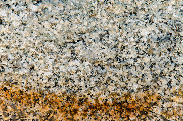 Rust on a granite wall. Background wall of an old building. Close-up.