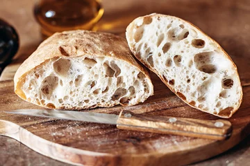 Fotobehang Zelfgemaakt rustiek ambachtelijk brood of Italiaanse ciabatta © Mr. Music