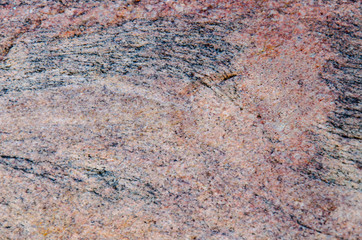 Granite background. The wall of the old building. Close-up.