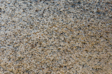 Granite background. The wall of the old building. Close-up.