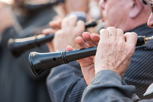 Men playing a typical wind instrument of the celebration of the Fallas of Valencia, called "Dol&ccedil;aina" or "Dulzaina"