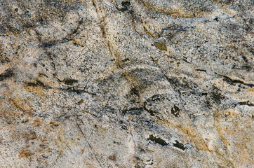 Granite background. The wall of the old building. Close-up.