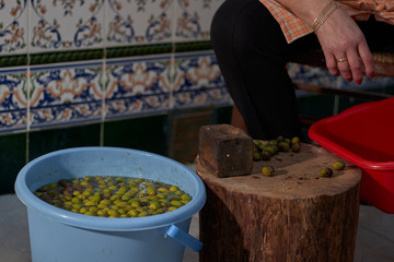Breaking olives for snacks, handmade