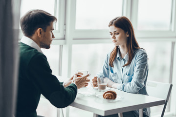 couple having breakfast in the kitchen
