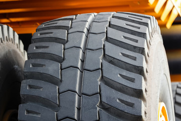Close - up of the wheel of a huge dump truck