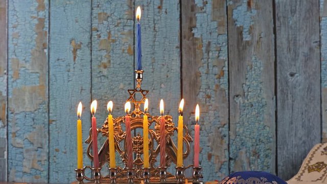 Nine Hanukkah candles are burning on light last eighth day of the Jewish holiday