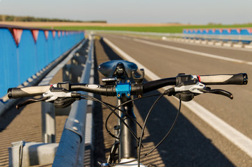 Bicycle is on the road. Tourism on the bike.