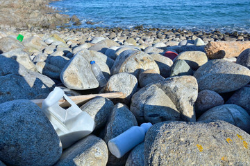 Plastic waste dragged by the sea to a beach on the Atlantic coast of Galicia. This trash when...