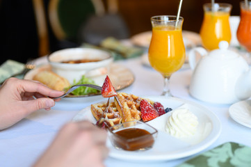 morning Breakfast or brunch in the restaurant. table with drinks and food. selective focus
