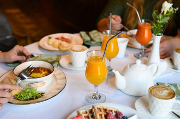 morning Breakfast or brunch in the restaurant. table with drinks and food. selective focus