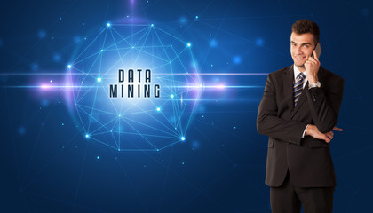 Businessman thinking about security solutions with DATA MINING inscription