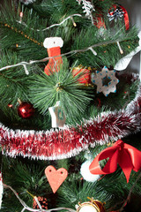 Decorating your favorite Christmas tree. Create cosiness in your house.  Prepare your home for holidays. White and red decorations. Green.