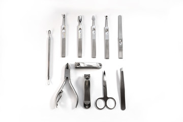 Metallic manicure set with black case on an isolated white background. Beauty salon and tools for nails. Women's handbag gift