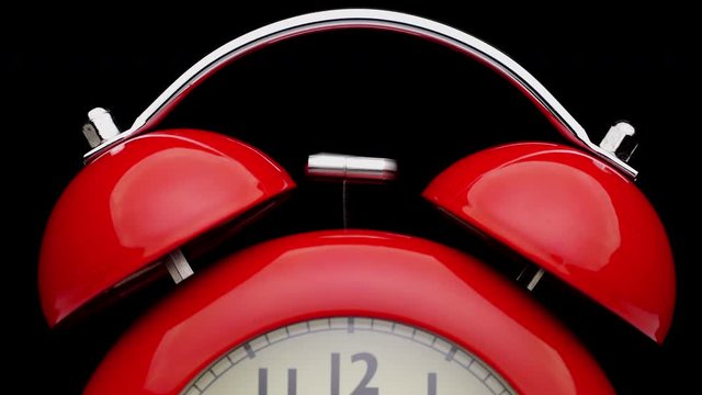 Red alarm clock. Close up view.