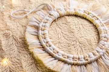Obraz premium Handmade macrame circle decoration on artificial fur