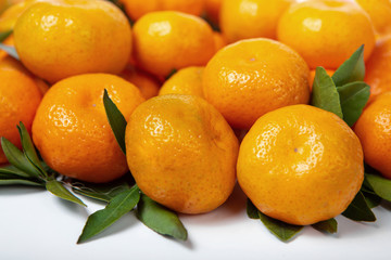 Bright tangerines on a white isolated background.