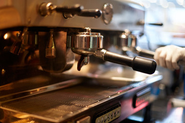 Fototapeta na wymiar Making coffee in a professional coffee machine in a coffee shop