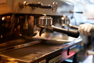 Making coffee in a professional coffee machine in a coffee shop