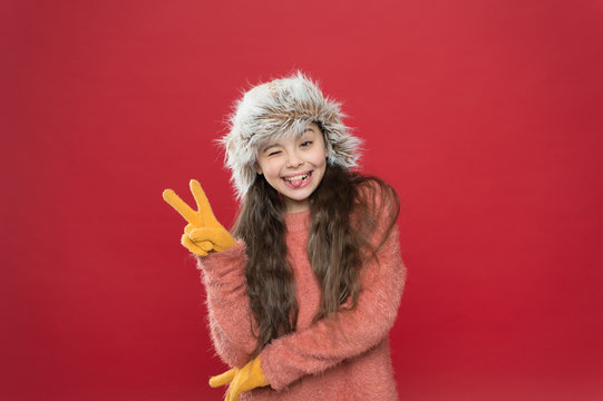 Hey There. Happy Little Girl In Earflap Hat. Holiday Activity Outdoor. Small Child Ready For Winter. Seasonal Health Care. Kid Fashion. Warm Clothes And Accessory Tips. Cold Weather Adventures