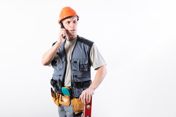 Builder talking on a cell phone.