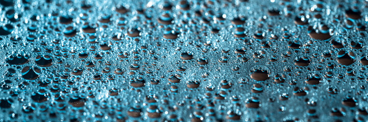 Modern banner with shiny drops of water on a blue background, abstract rainy wallpaper