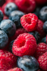 Fresh Summer Berries mix Background with Strawberry, Raspberry, Red currant, Blueberry and Blackberry.