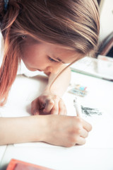 Happy young creative teenager student girl drawing sketch creativity studying process