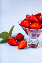 Ripe strawberries and leaves