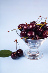 Ripe cherries in a glass bowl