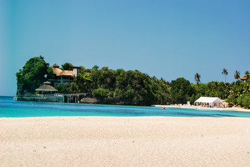 View on Balatero Cove bay fishermans village and traditional boats. Puerto Galera in Oriental...