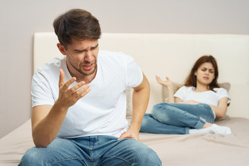 Fototapeta na wymiar couple sitting on sofa and watching tv