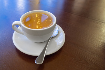 a Cup of green tea on a wooden table in a cafe