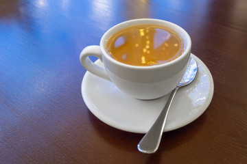 a Cup of green tea on a wooden table in a cafe