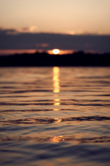 Sunset at the pond with reflections in the water