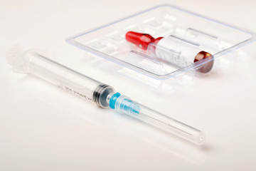 ampoule with medicine and syringe. The vitamin B complex