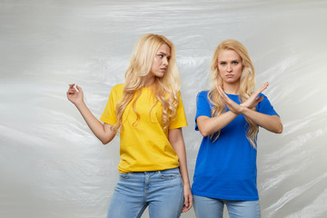 Young women volunteers in yellow and blue t-shirts campaign against the use of polyethylene and...