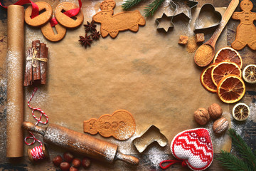 Christmas festive baking background with traditional ingredients and props for making ginger cookies. Top view with copy space.