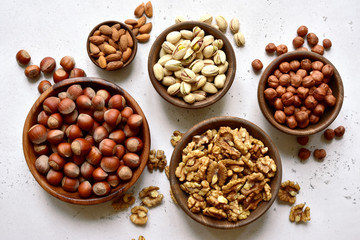 Assortment of nuts in a bowls. Top view with copy space.