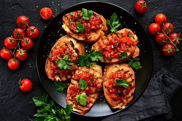Grilled toasts with tomato salsa. Top view with copy space. - obrazy, fototapety, plakaty