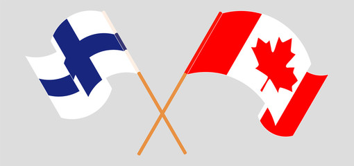 Crossed and waving flags of Canada and Finland