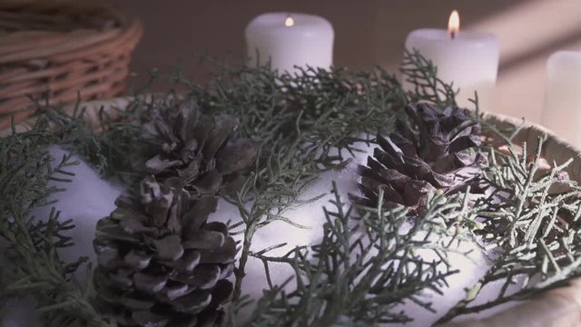 Christmas scene with pine cones and candles