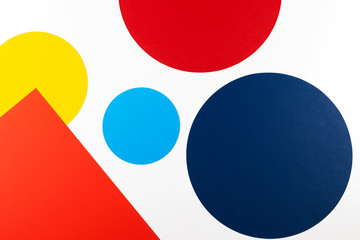 Abstract colored paper texture background. Geometric shapes and lines in blue, red, yellow, navy colors on white background